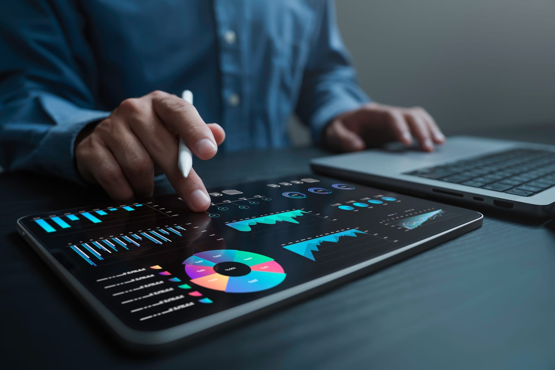 man finger touching table with charts on it